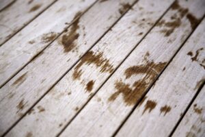 Faded deck stain on backyard wood deck in NJ before restoration