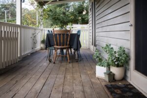 New Jersey homeowner inspecting a deck for restoration and safety concerns
